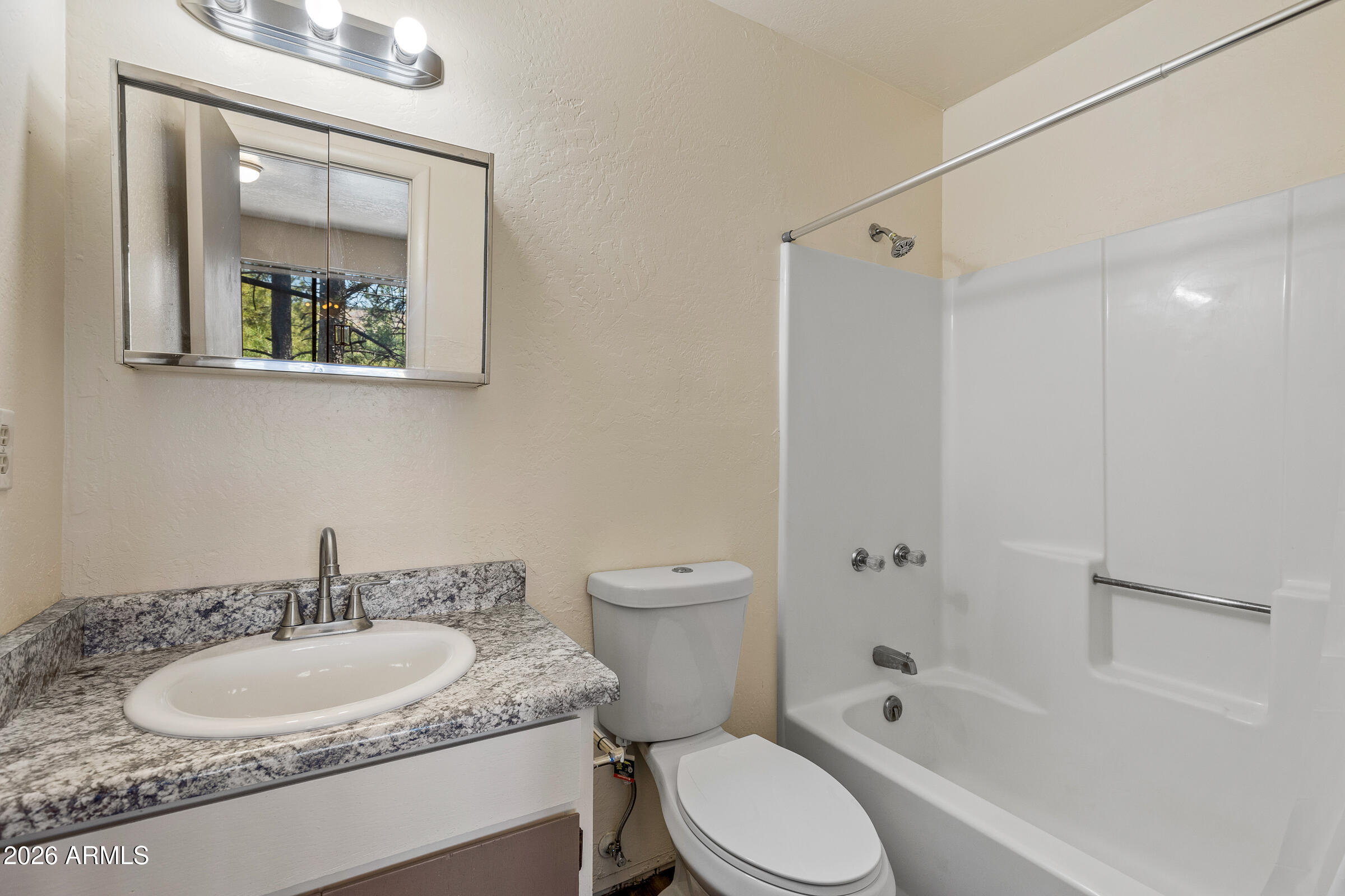 108 East Paseo Del Rio Flagstaff, AZ 86001 - Photo 13 of 25 a bathroom with a granite countertop sink toilet and shower