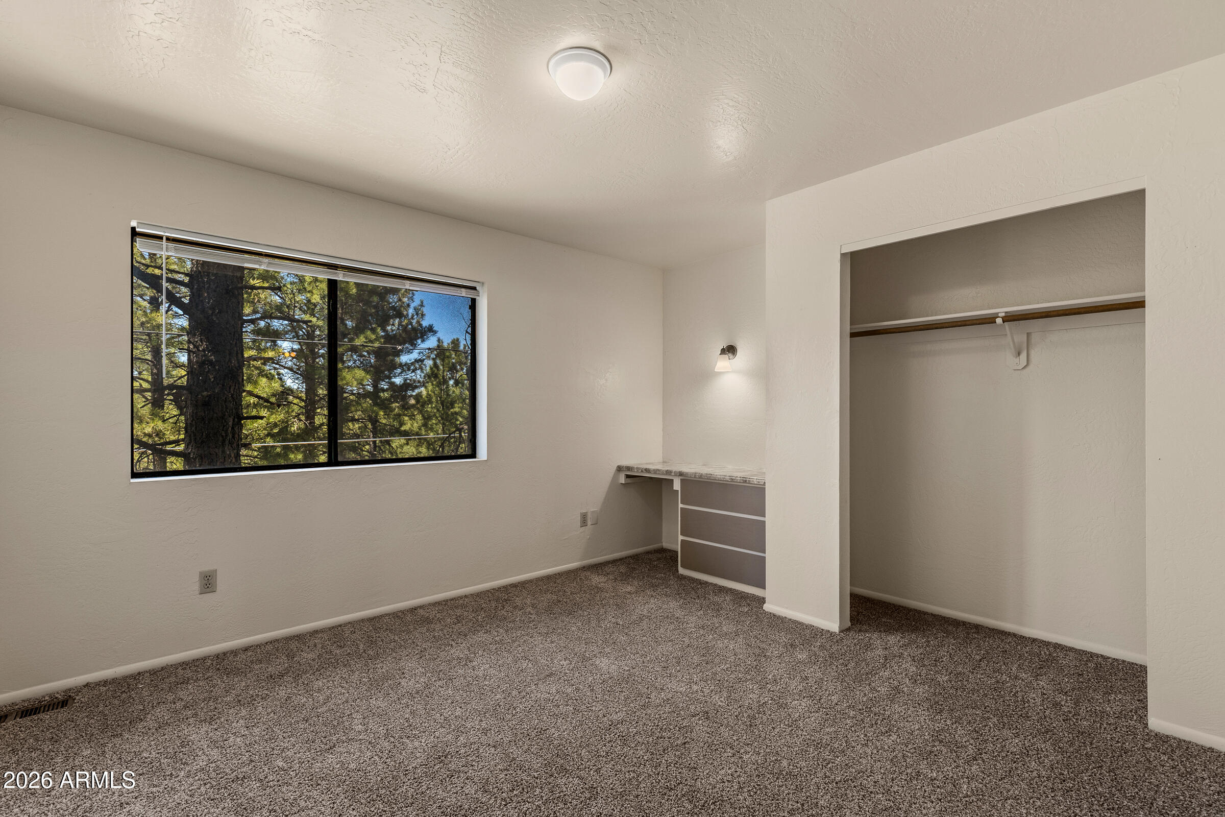 108 East Paseo Del Rio Flagstaff, AZ 86001 - Photo 14 of 25 an empty room with windows