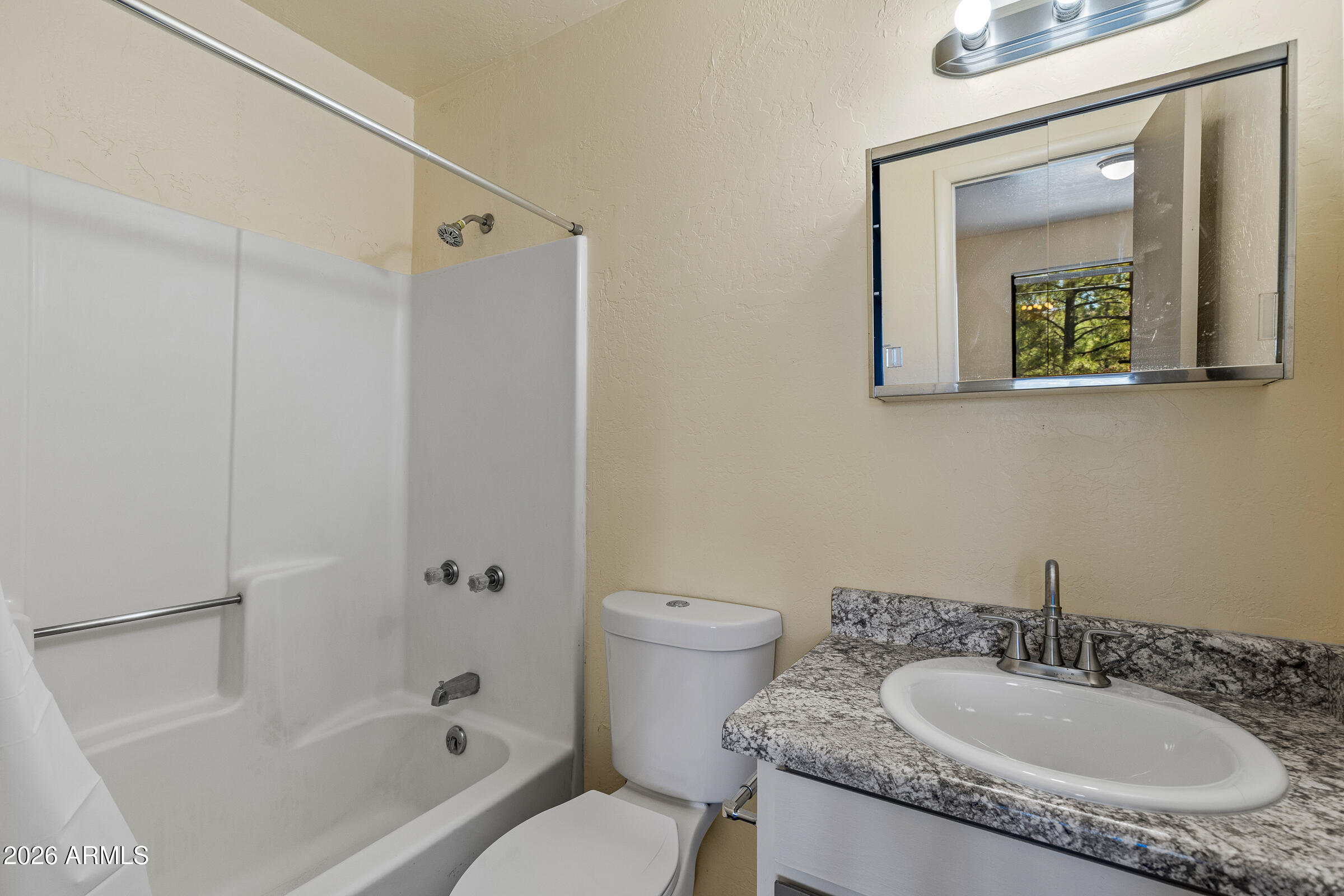 108 East Paseo Del Rio Flagstaff, AZ 86001 - Photo 16 of 25 a bathroom with a granite countertop sink toilet and shower