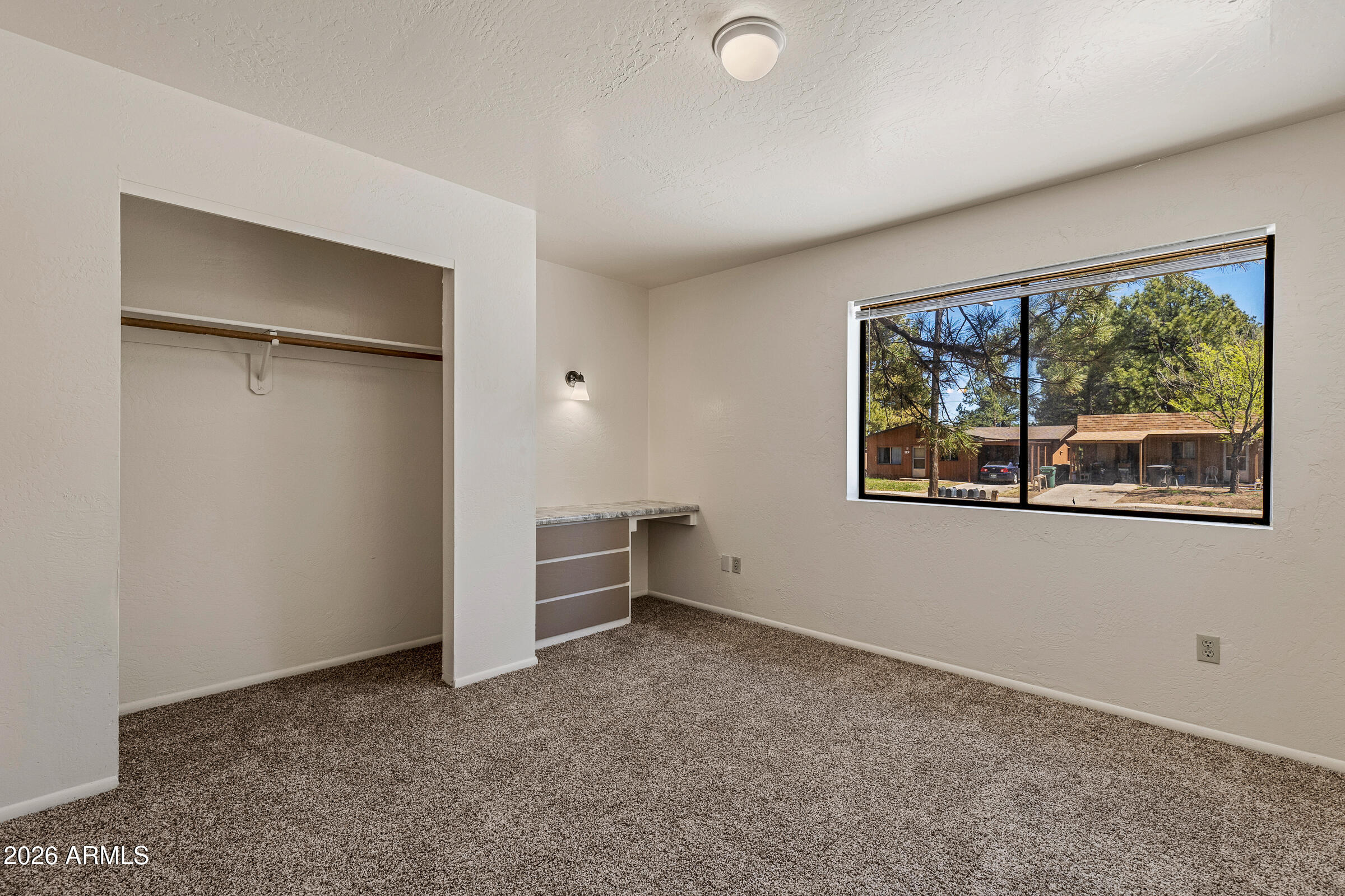 108 East Paseo Del Rio Flagstaff, AZ 86001 - Photo 17 of 25 an empty room with windows and closet