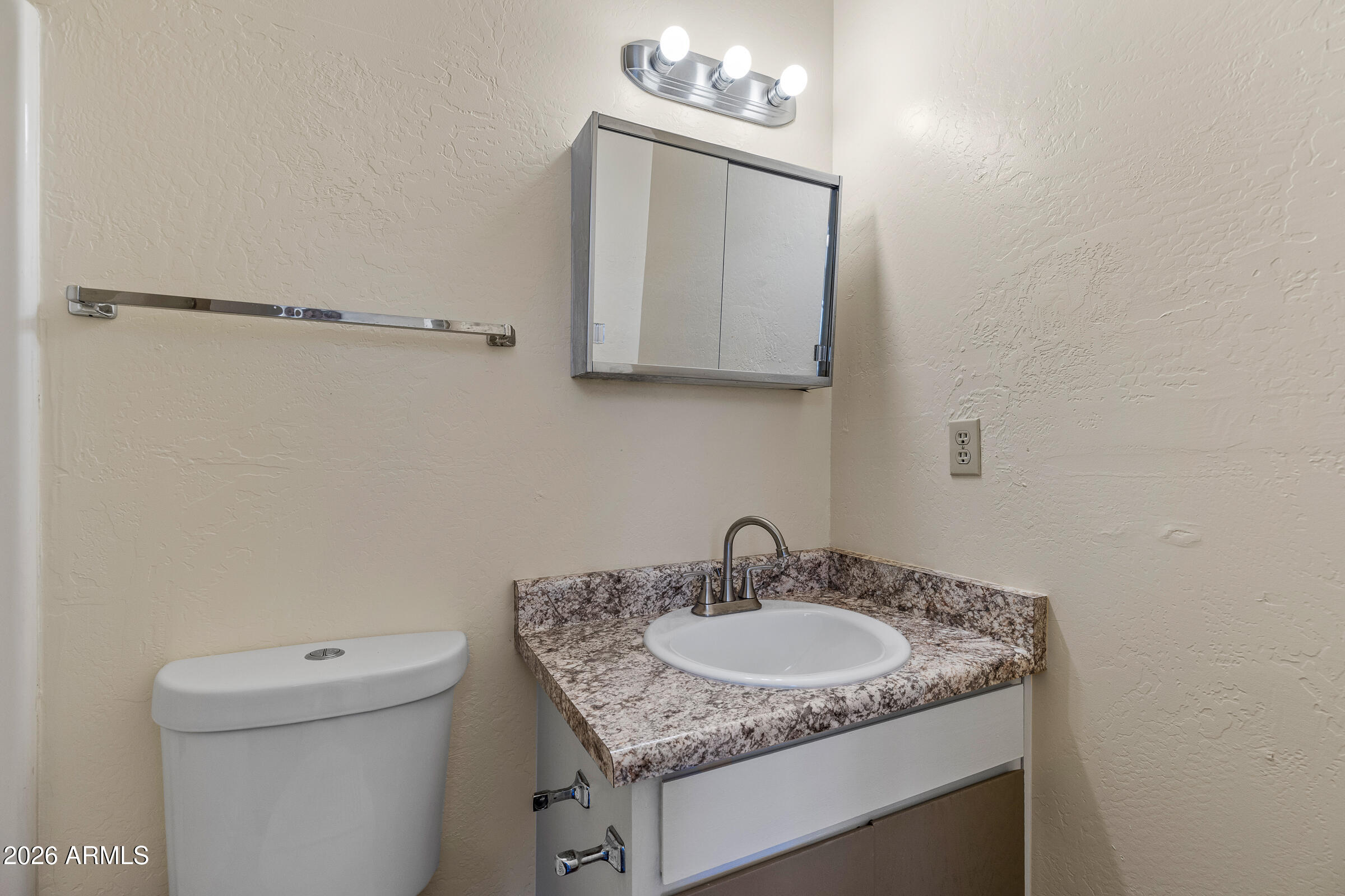 108 East Paseo Del Rio Flagstaff, AZ 86001 - Photo 19 of 25 a bathroom with a granite countertop sink and a toilet