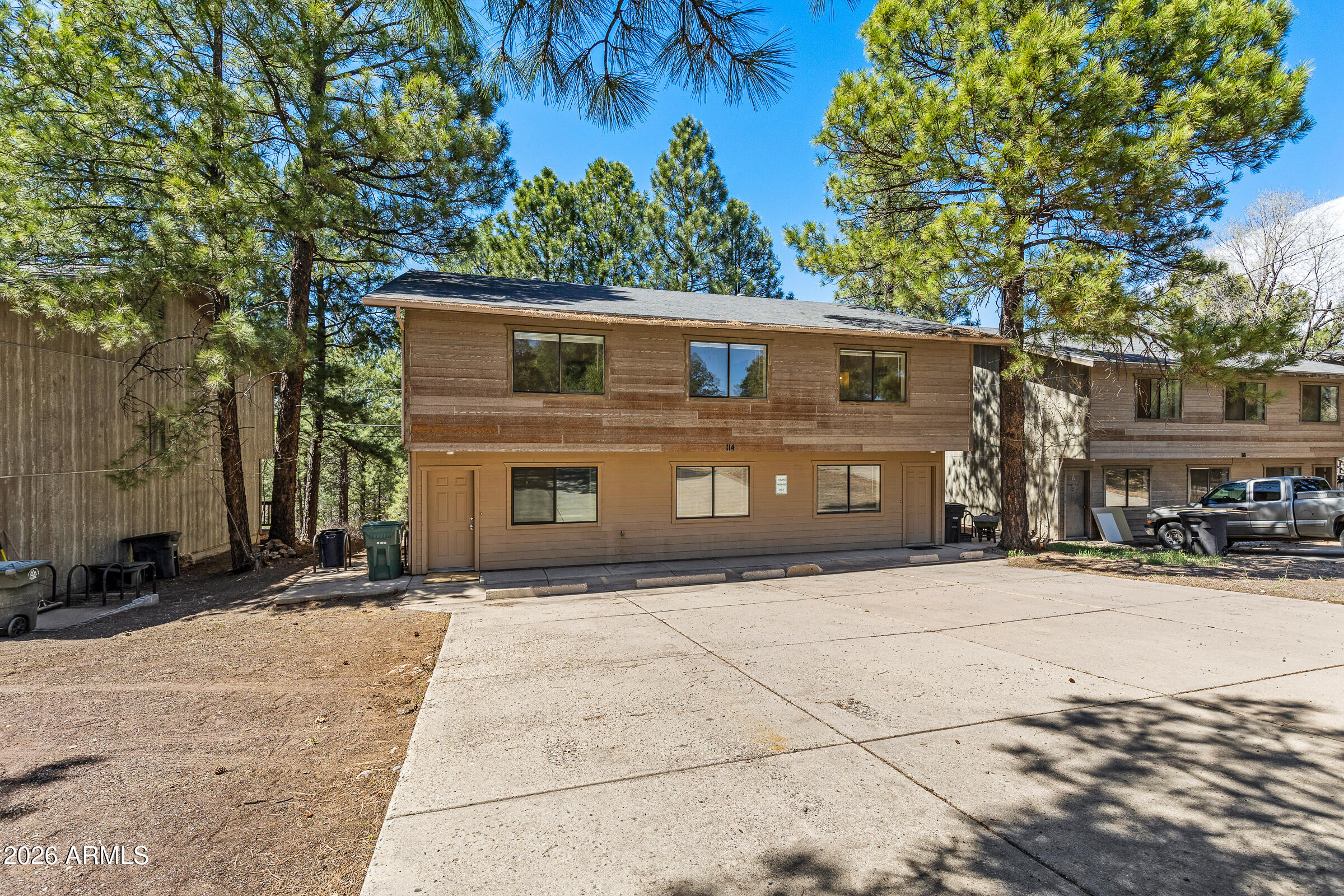 108 East Paseo Del Rio Flagstaff, AZ 86001 - Photo 3 of 25 a front view of a house with a yard
