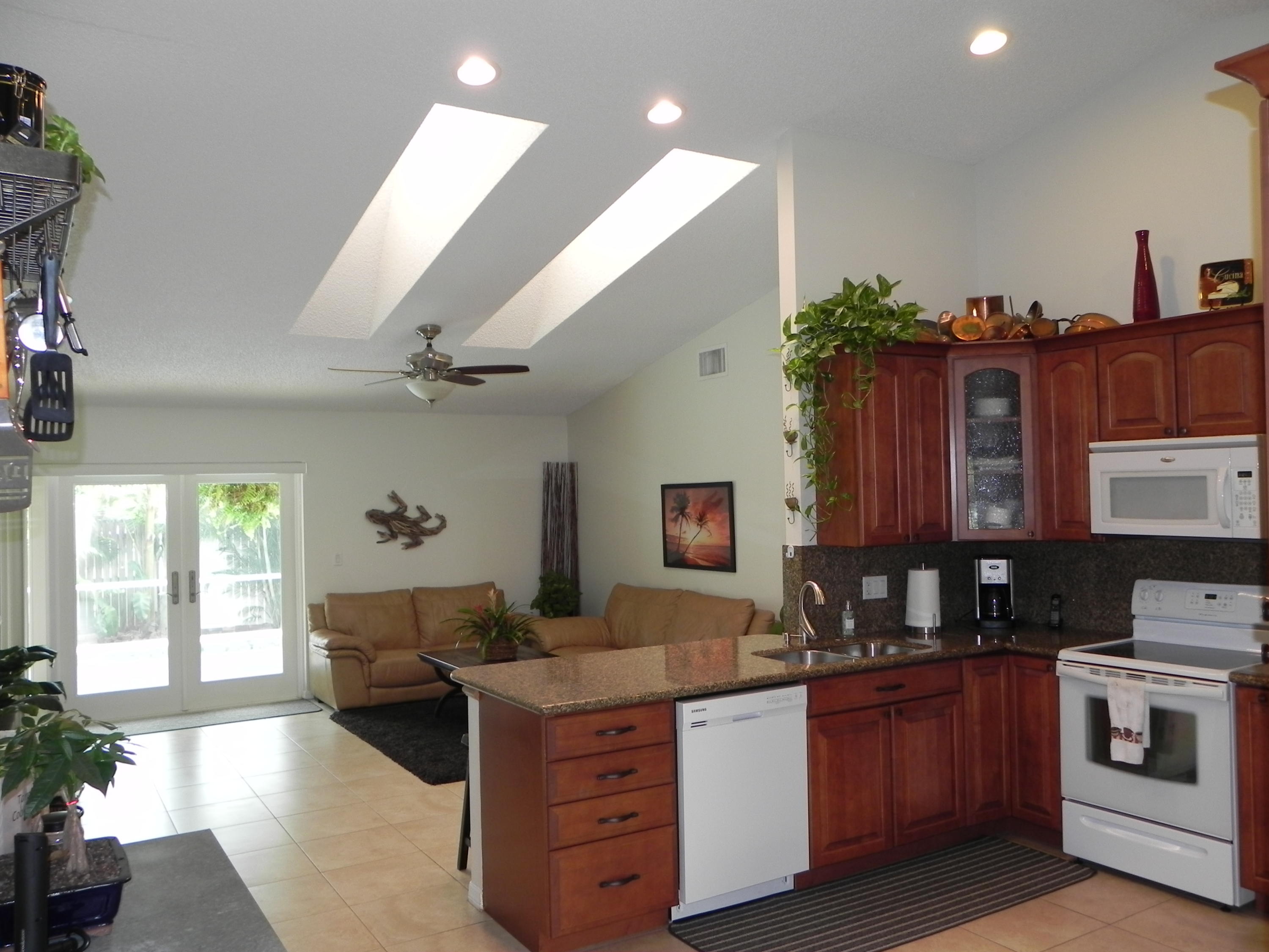 7450 Rosewood Circle Boca Raton, FL 33487 - Photo 4 of 26 a kitchen with stainless steel appliances granite countertop a stove and cabinets