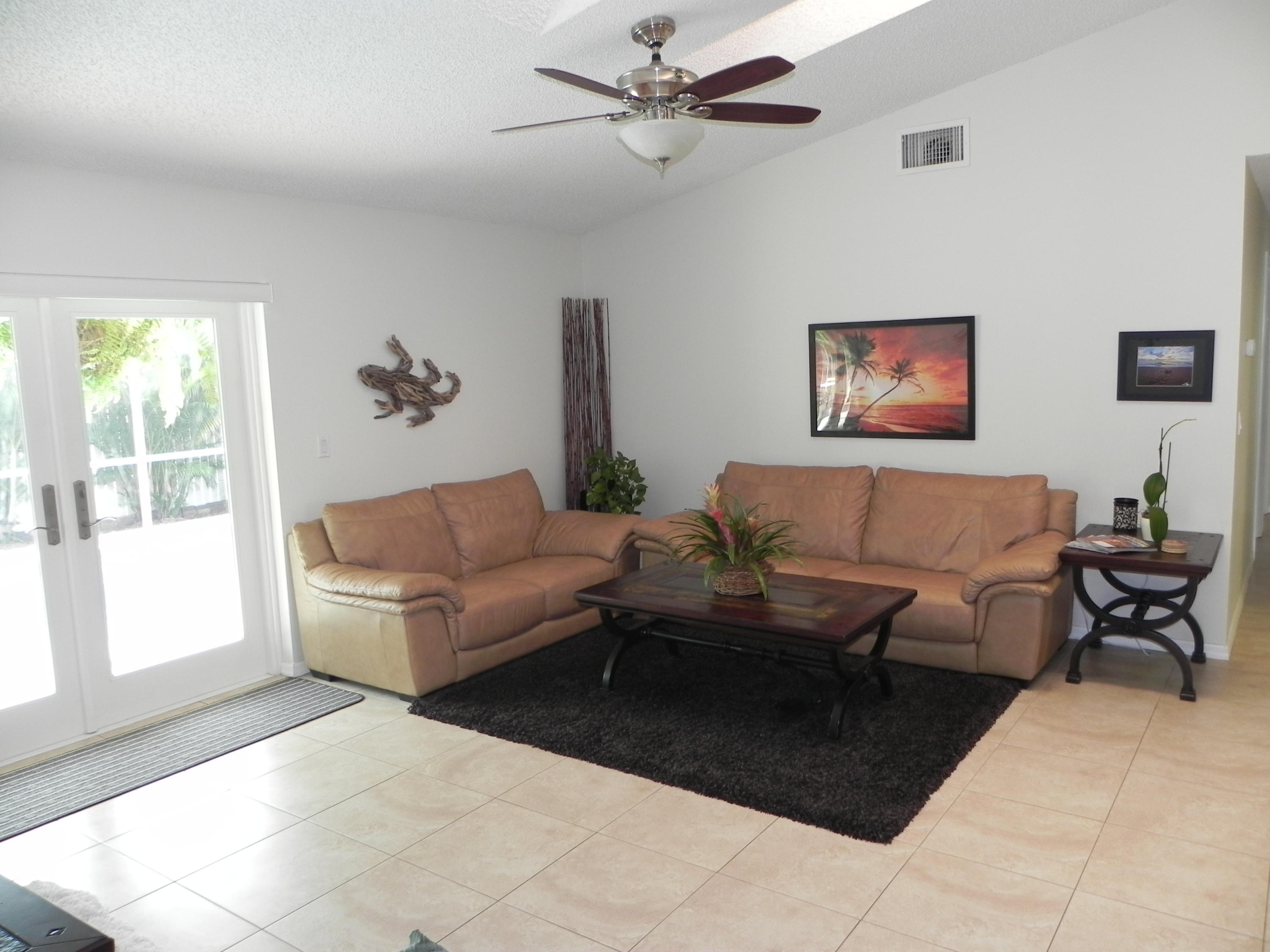 7450 Rosewood Circle Boca Raton, FL 33487 - Photo 5 of 26 a living room with furniture and a window