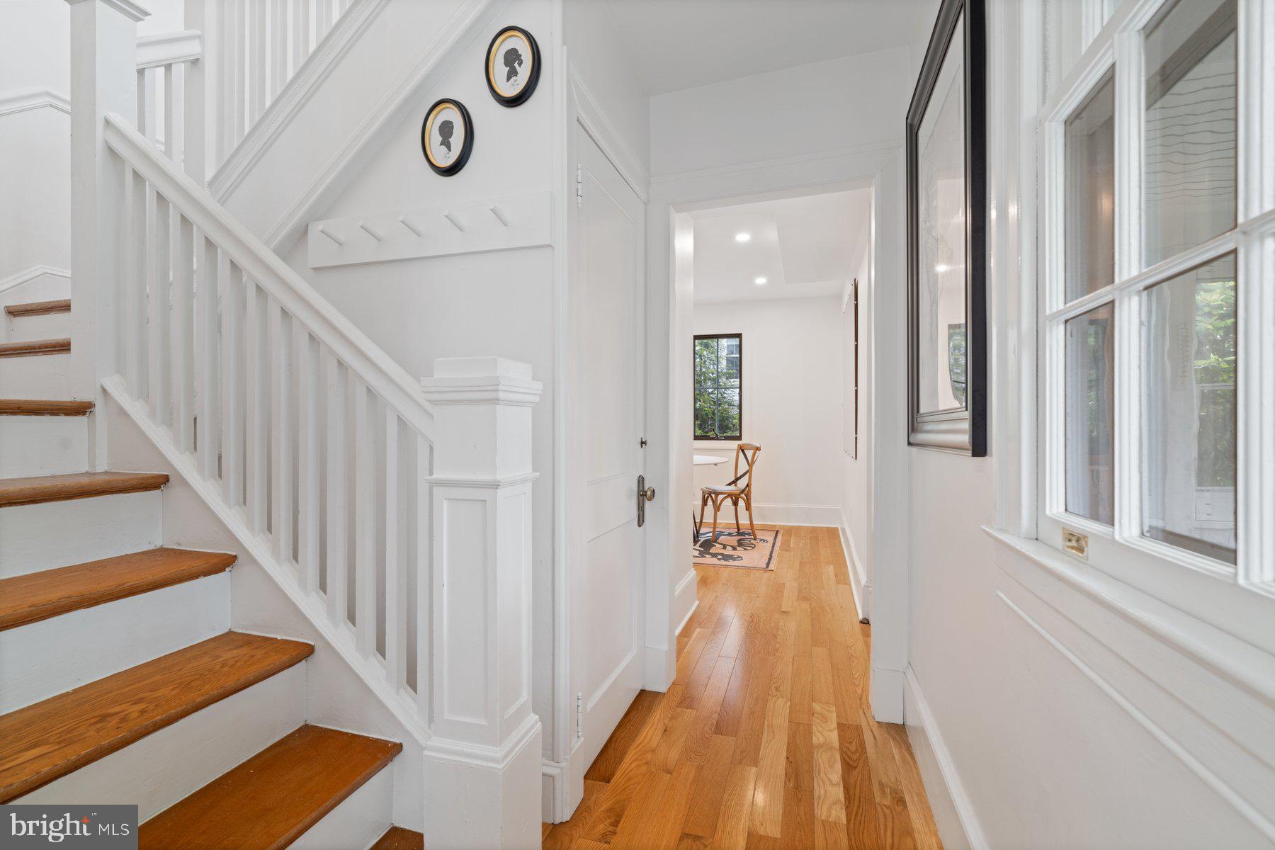 7113 Bristol Road Baltimore, MD 21212 - Photo 16 of 31 a view of a hallway with wooden floor and staircase