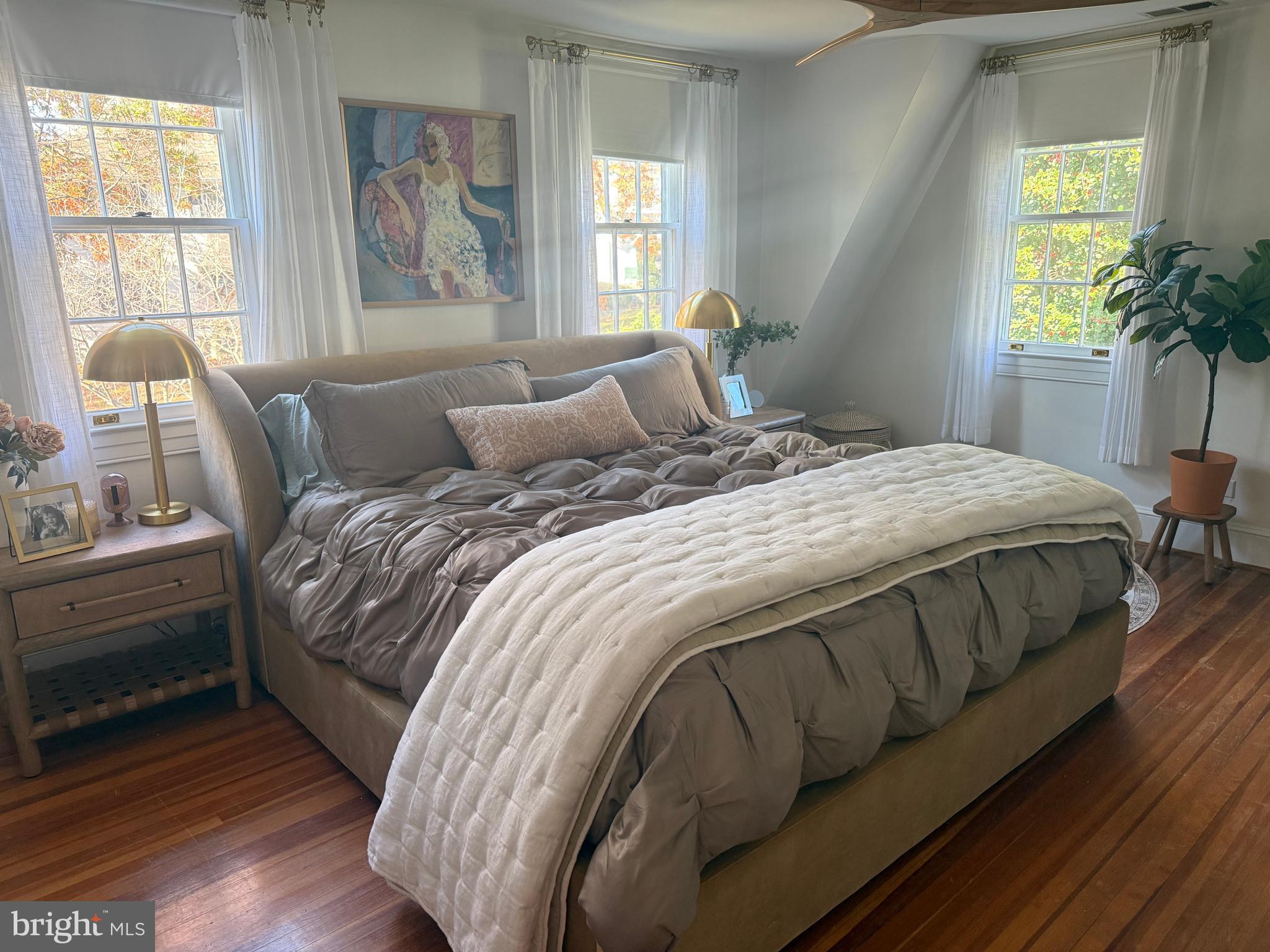 7113 Bristol Road Baltimore, MD 21212 - Photo 18 of 31 a bedroom with a bed and wooden floor