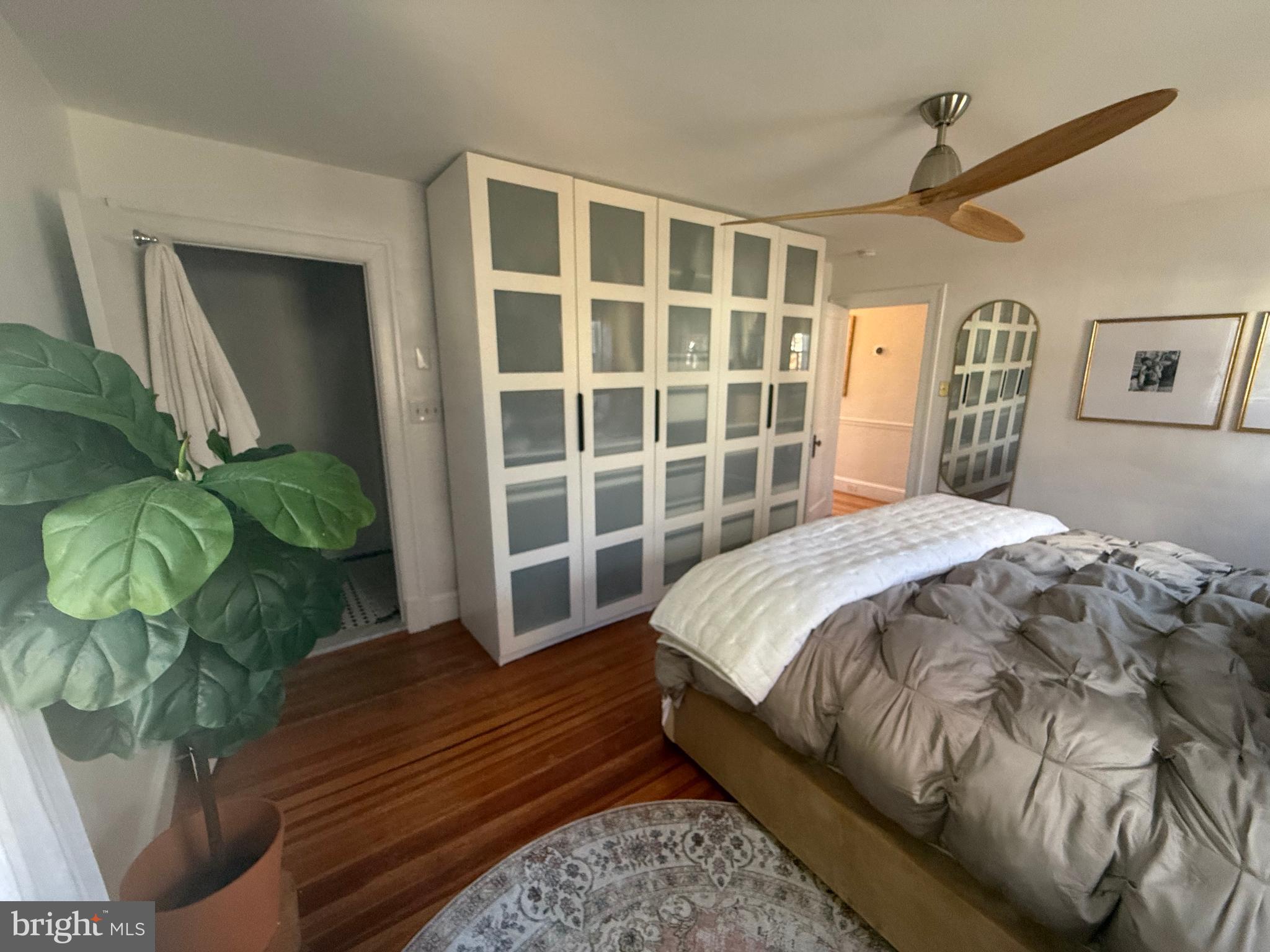 7113 Bristol Road Baltimore, MD 21212 - Photo 19 of 31 a spacious bedroom with a bed and a window