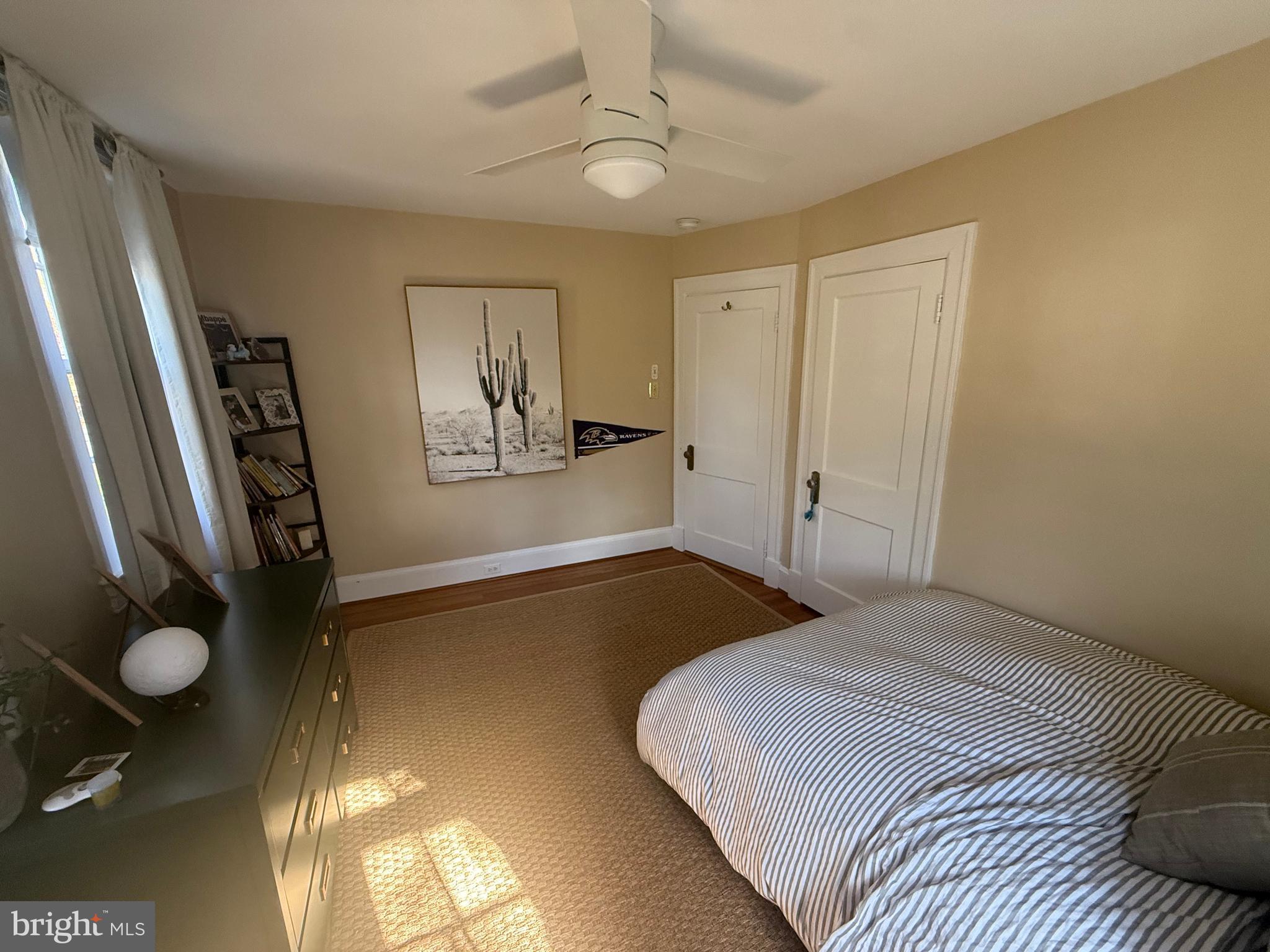 7113 Bristol Road Baltimore, MD 21212 - Photo 23 of 31 a bedroom with a bed and a chandelier