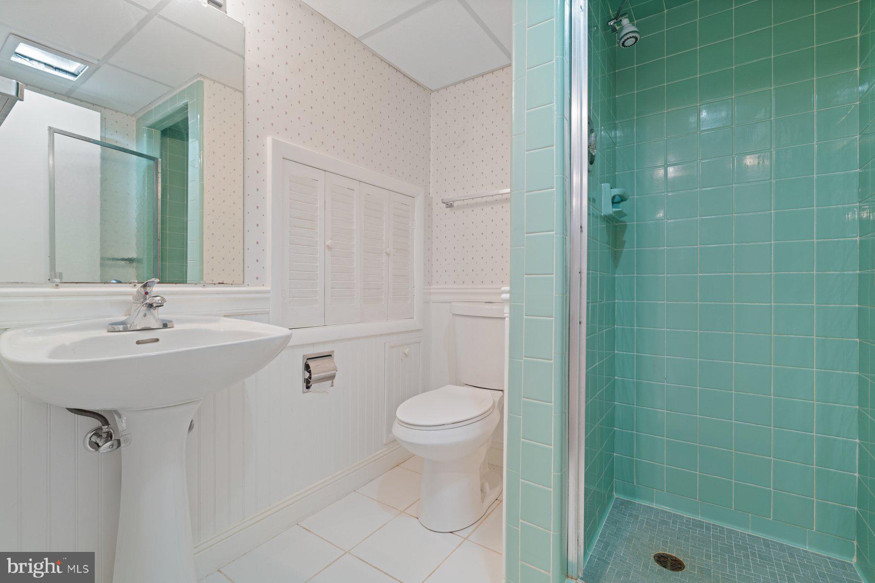 7113 Bristol Road Baltimore, MD 21212 - Photo 26 of 31 a bathroom with a sink a toilet and shower