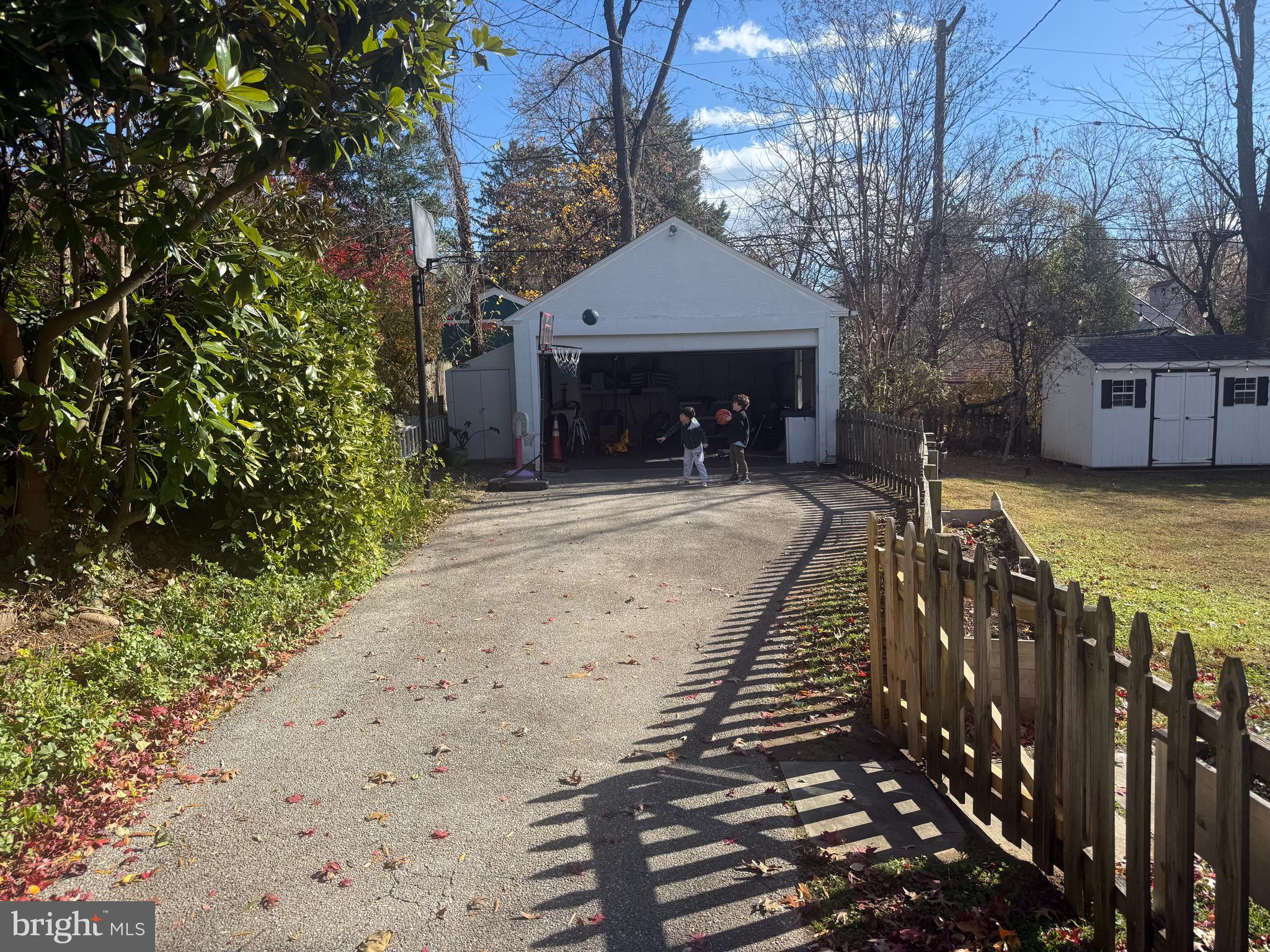 7113 Bristol Road Baltimore, MD 21212 - Photo 30 of 31 a view of a house with wooden fence next to a yard