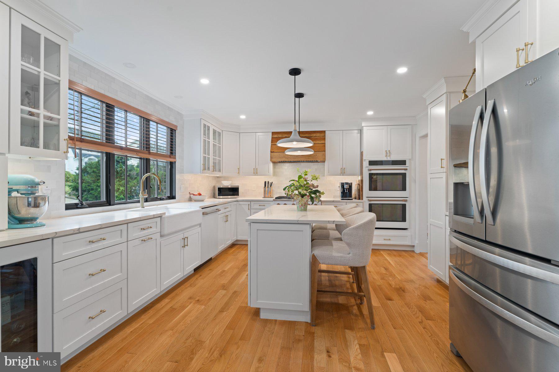 7113 Bristol Road Baltimore, MD 21212 - Photo 3 of 31 a kitchen with stainless steel appliances granite countertop a refrigerator a stove top oven and a sink