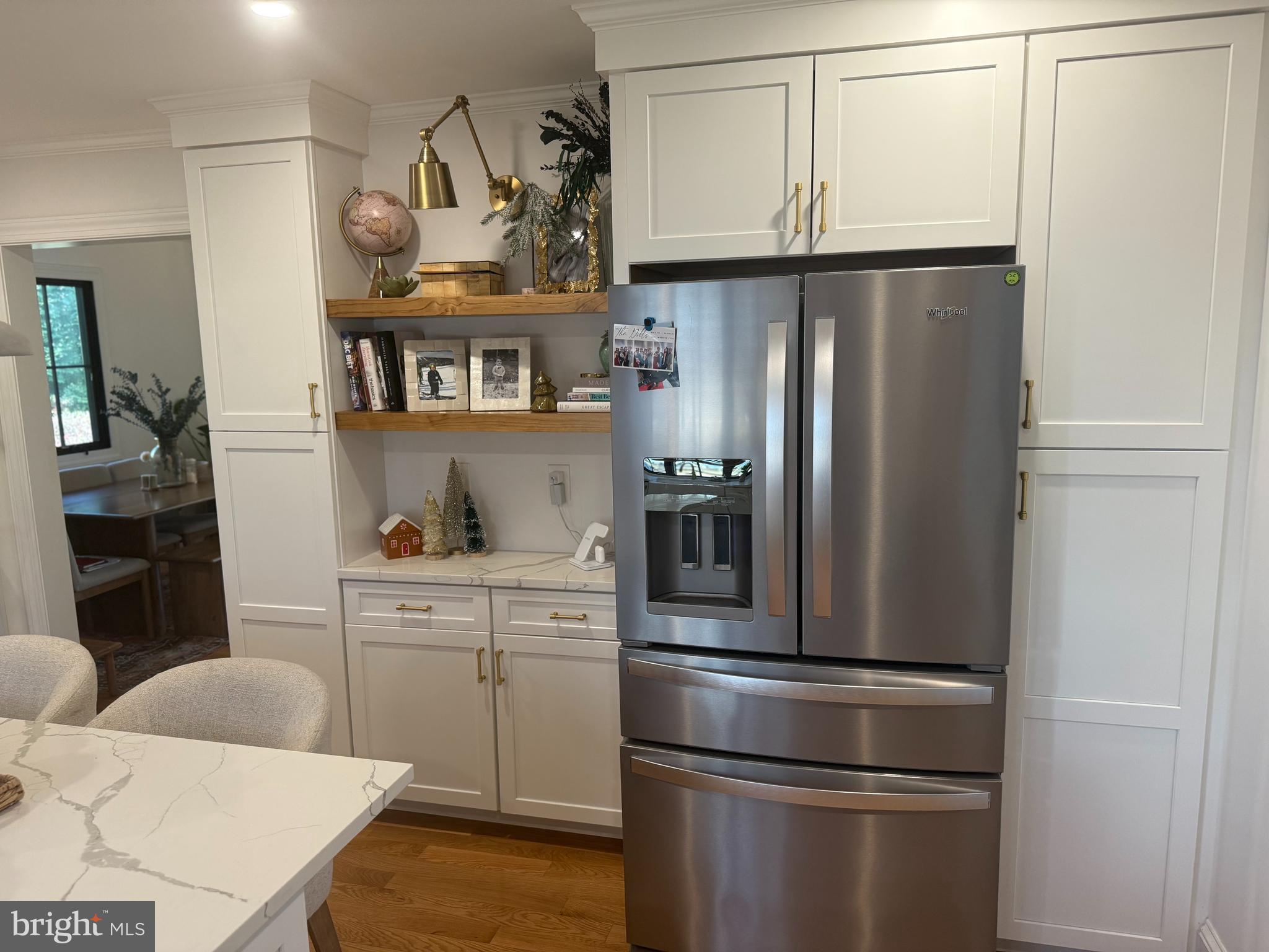 7113 Bristol Road Baltimore, MD 21212 - Photo 7 of 31 a kitchen with stainless steel appliances a refrigerator and cabinets