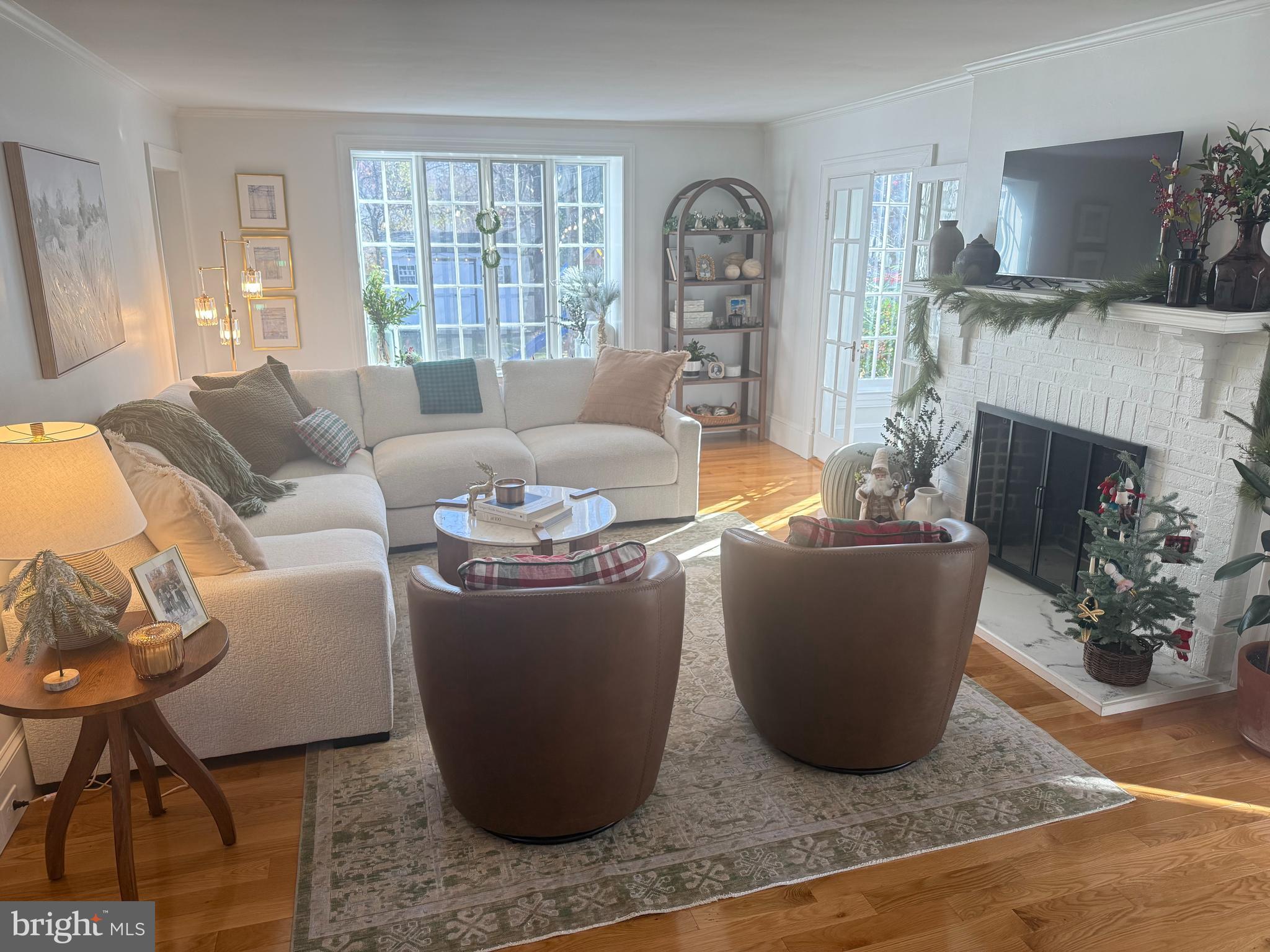 7113 Bristol Road Baltimore, MD 21212 - Photo 9 of 31 a living room with furniture a fireplace and a window