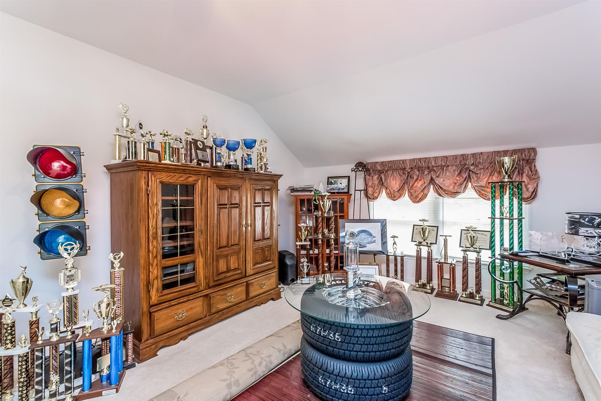 5253 Rustic Way Old Hickory, TN 37138 - Photo 17 of 27 a living room with furniture a chandelier and a flat screen tv