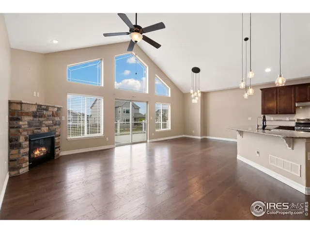 a view of livingroom with furniture wooden floor and fan