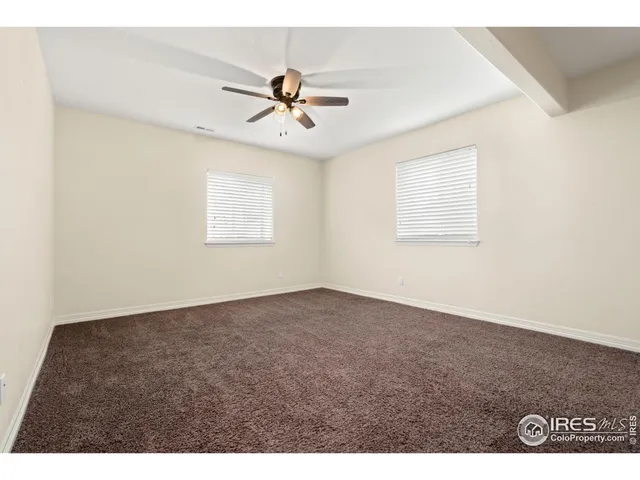 a bathroom with a granite countertop sink a mirror and vanity