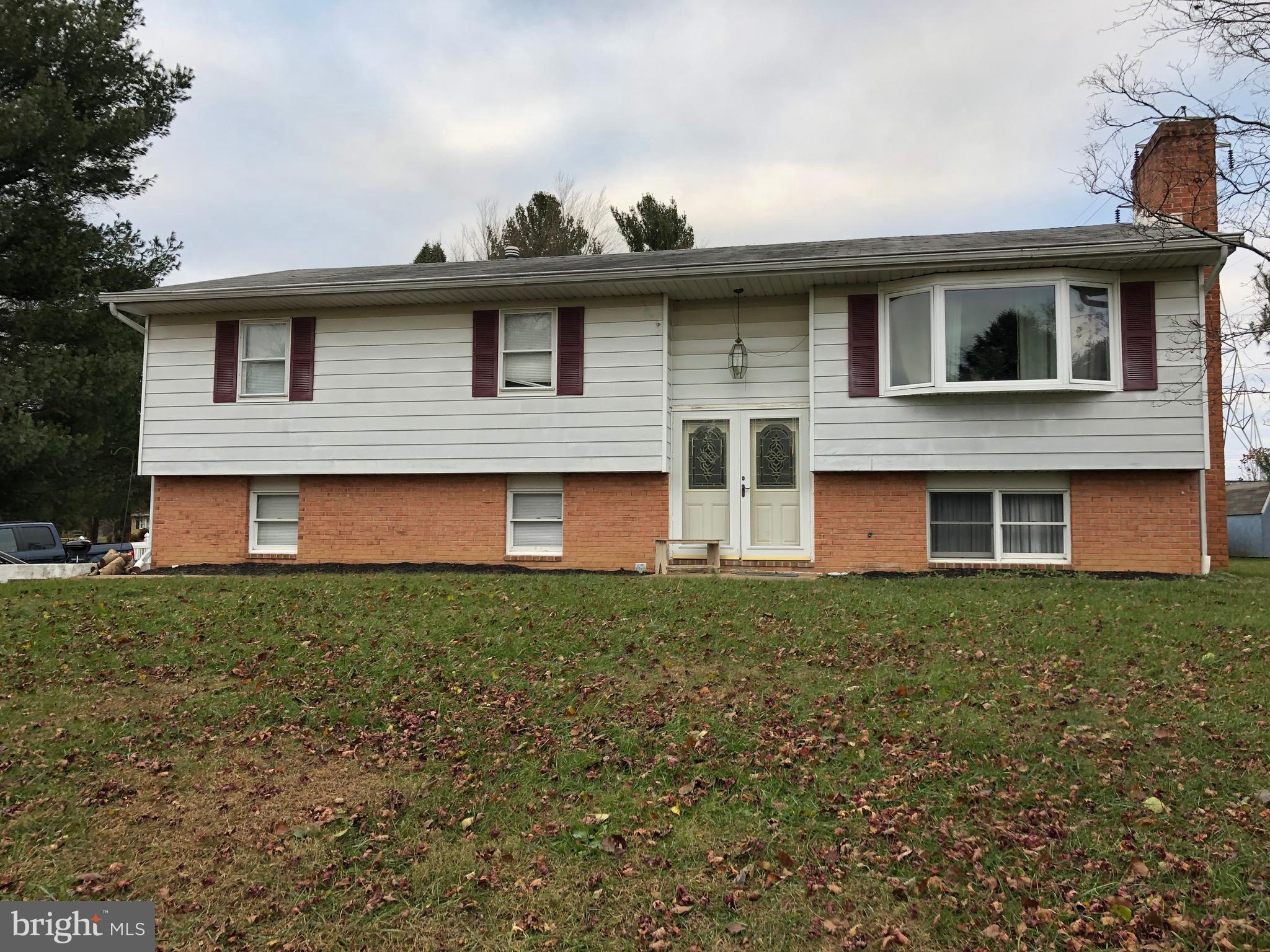 3201 Hunt Road Fallston, MD 21047 - Photo 1 of 29 a front view of a house with a garden