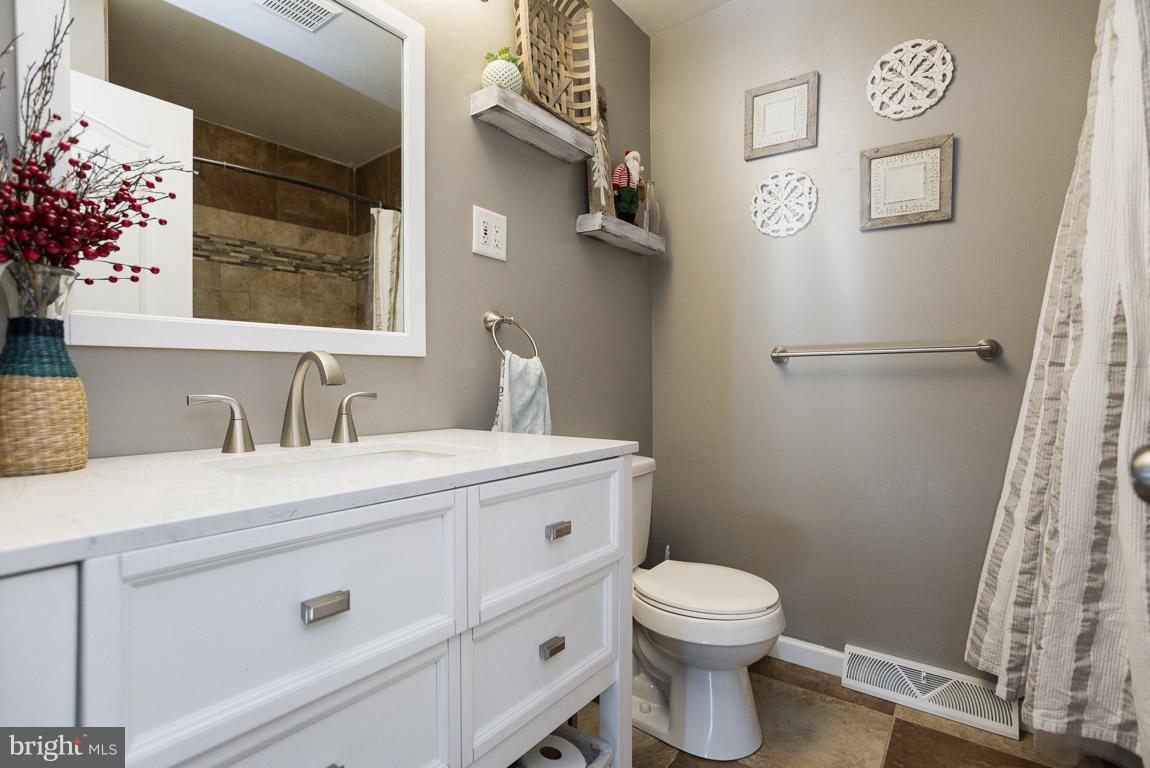 3201 Hunt Road Fallston, MD 21047 - Photo 11 of 29 a bathroom with a toilet a sink and a mirror
