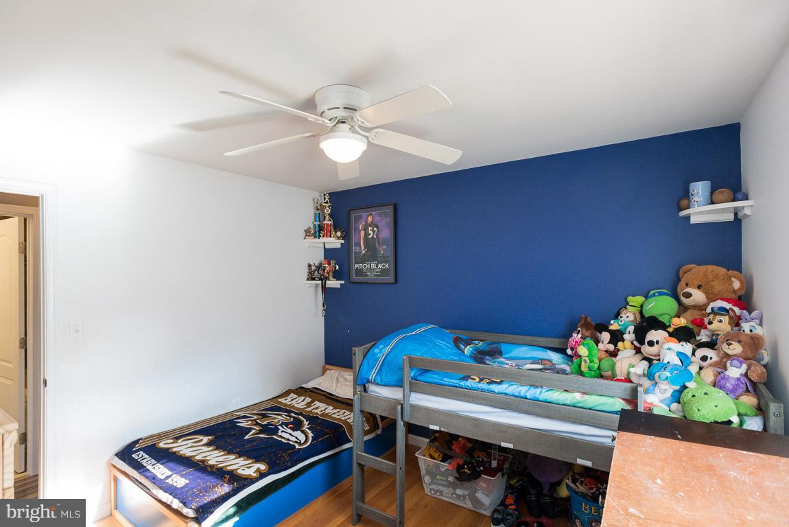 3201 Hunt Road Fallston, MD 21047 - Photo 14 of 29 a bedroom with a bed and a chandelier