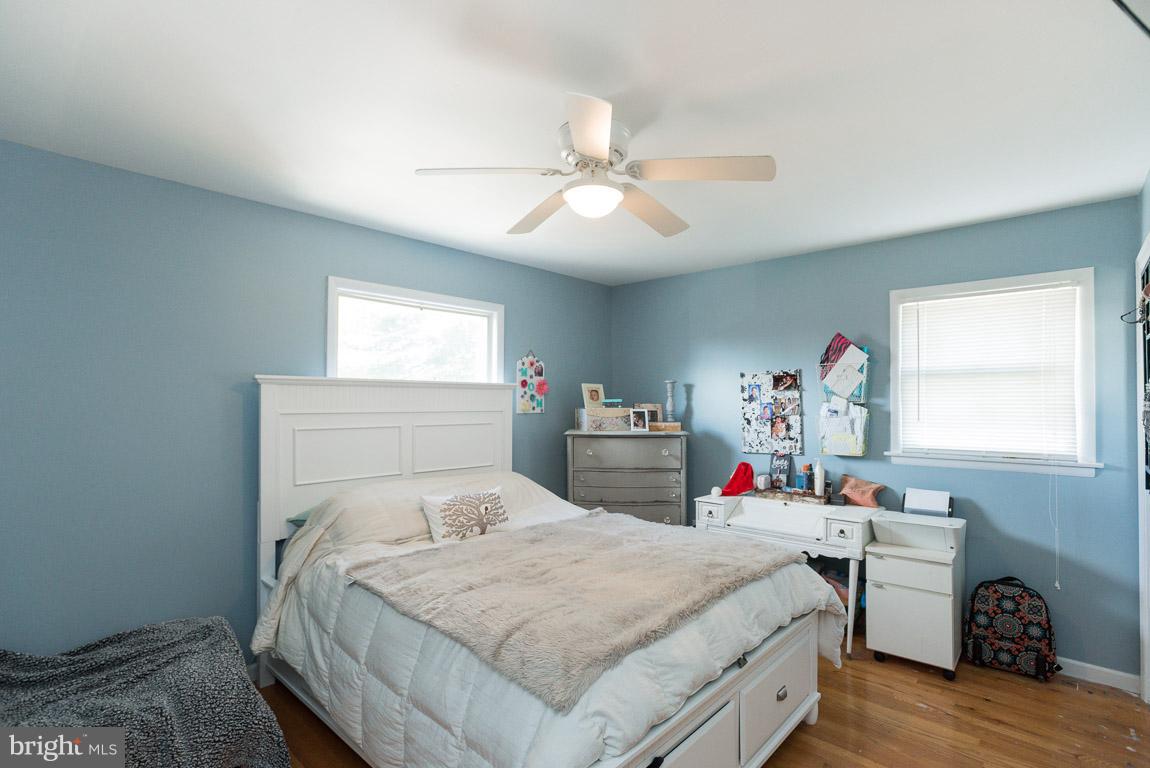 3201 Hunt Road Fallston, MD 21047 - Photo 17 of 29 a bedroom with a bed and a chandelier