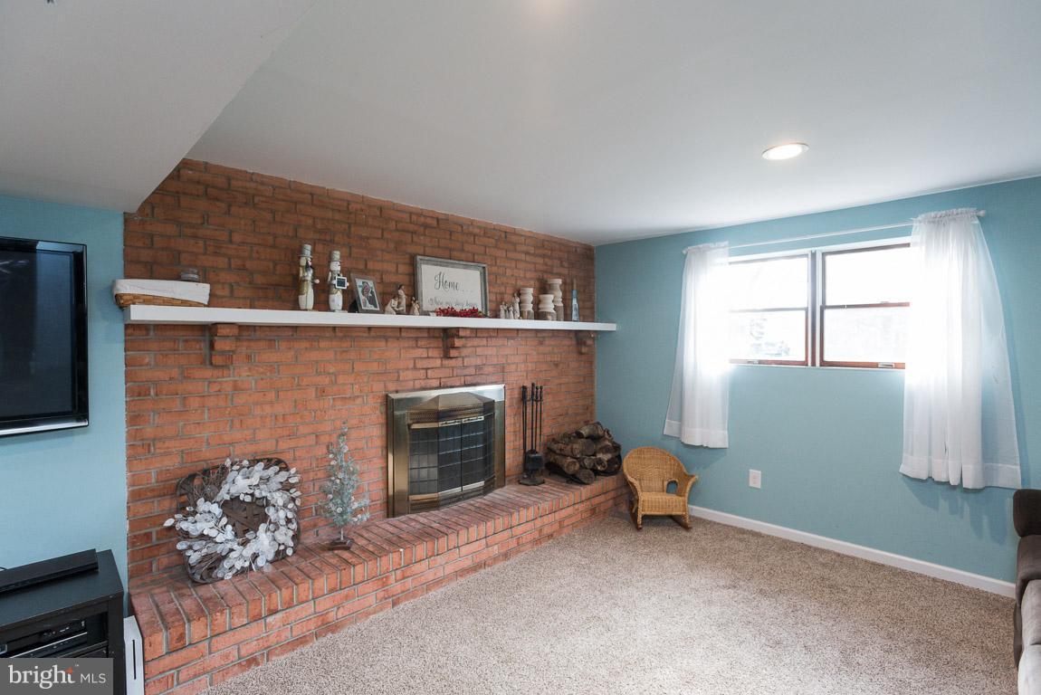 3201 Hunt Road Fallston, MD 21047 - Photo 20 of 29 a living room with furniture and a fireplace