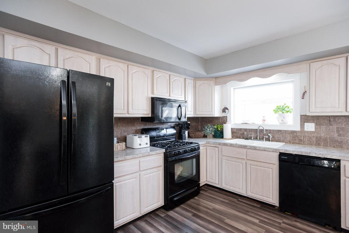 3201 Hunt Road Fallston, MD 21047 - Photo 6 of 29 a kitchen with a refrigerator sink and cabinets