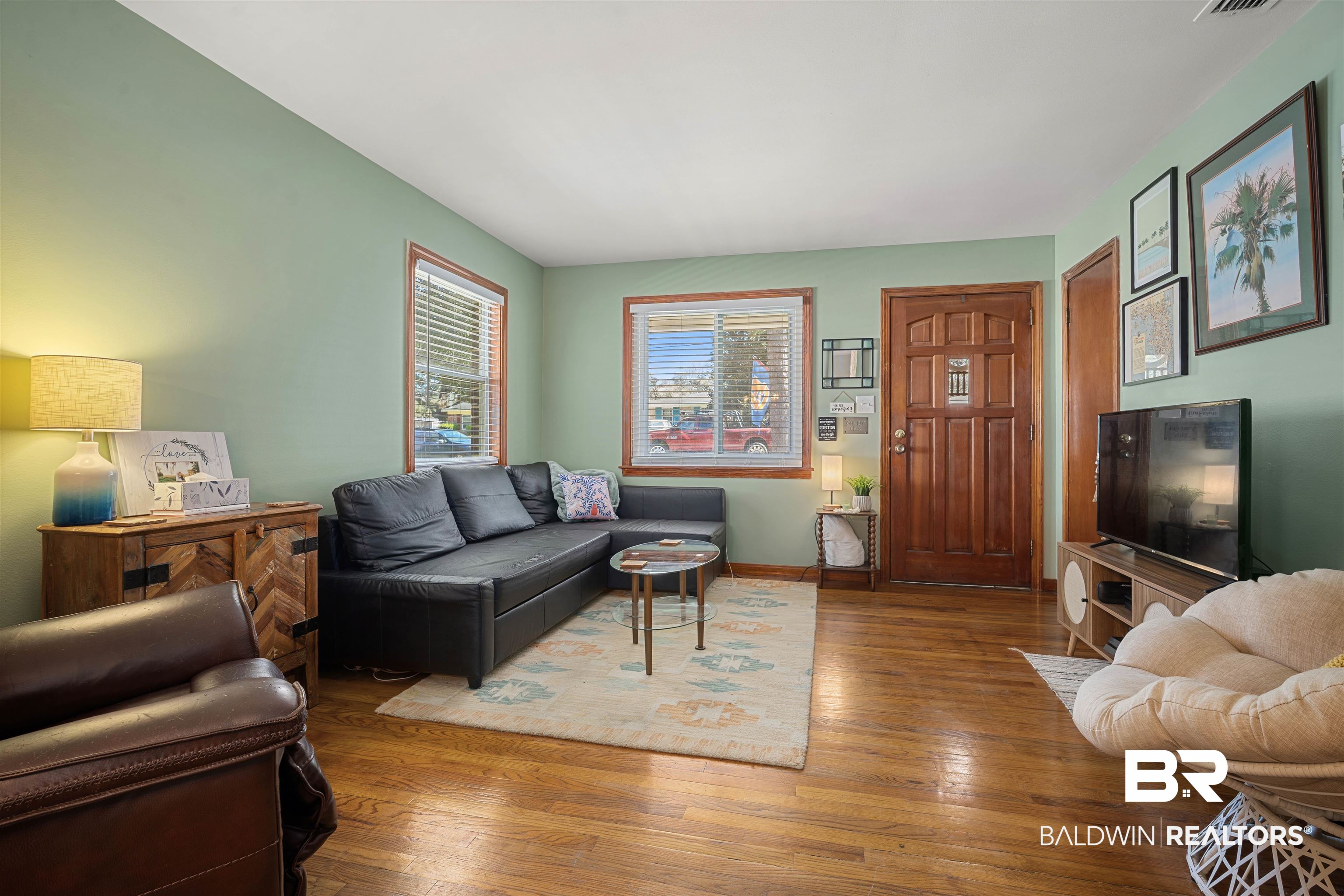 672 Tarawa Drive Mobile, AL 36609 - Photo 6 of 26 Living area featuring hardwood / wood-style floors and baseboards