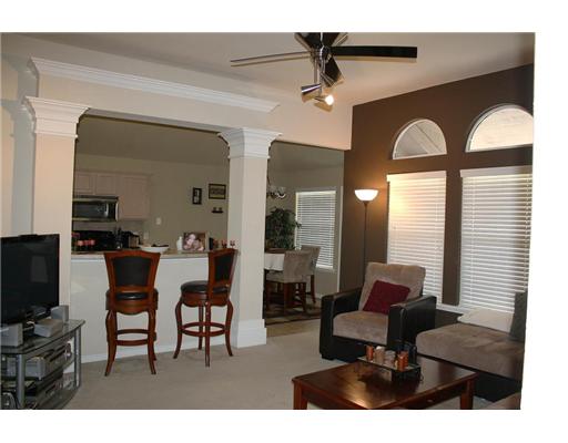 6713 Riding Wind Drive Corpus Christi, TX 78414 - Photo 2 of 10 a living room with furniture a flat screen tv and a large window
