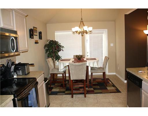 6713 Riding Wind Drive Corpus Christi, TX 78414 - Photo 5 of 10 a view of a dining room with furniture and chandelier