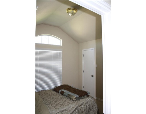 6713 Riding Wind Drive Corpus Christi, TX 78414 - Photo 8 of 10 a bedroom with a bed and a window