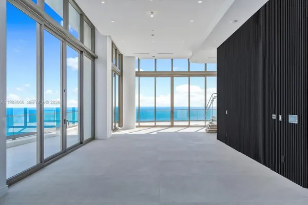 a view of an empty room with a balcony