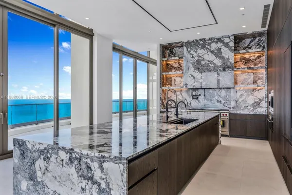 a view of an empty room with floor to ceiling window