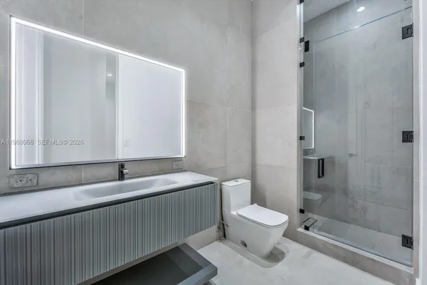 a view of a room with a flat screen tv