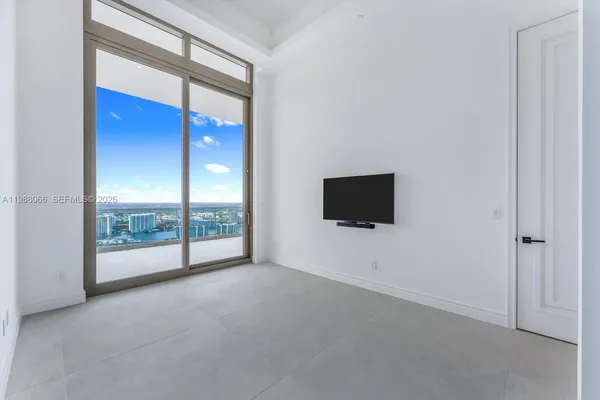 a view of a livingroom with an empty space and window