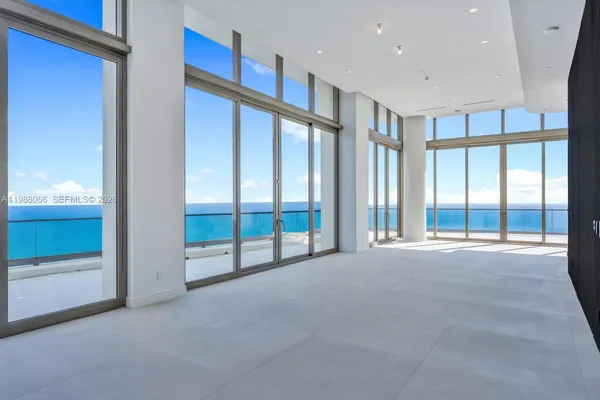 a view of an empty room with a sliding door