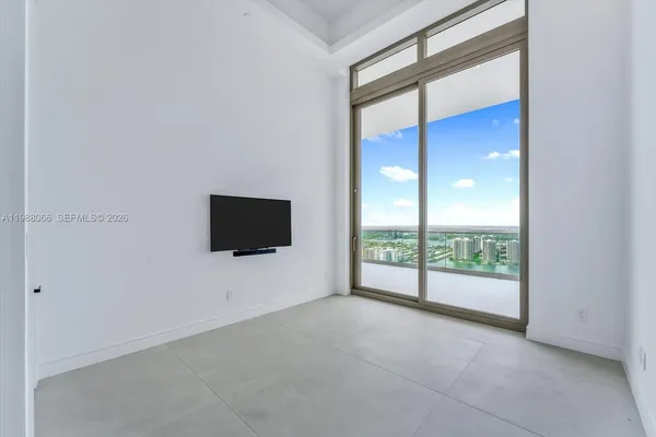 a view of an empty room with a window