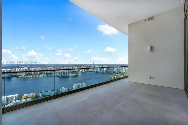 a view of balcony and yard