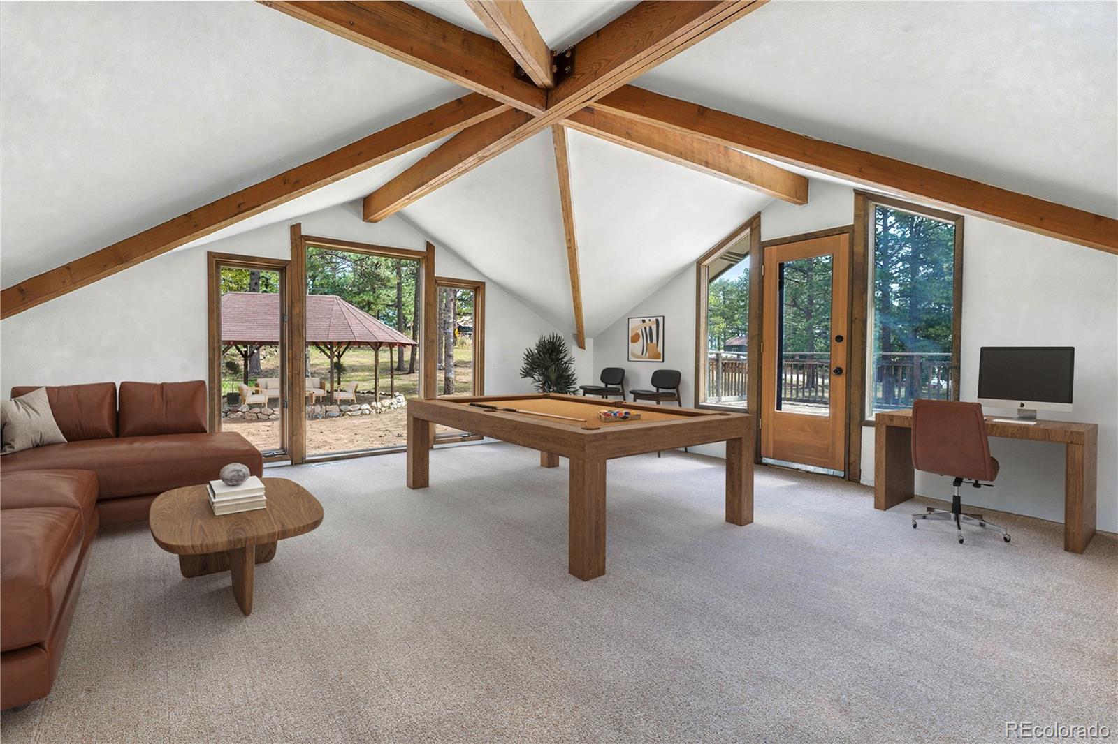 25997 Mountain View Road Golden, CO 80401 - Photo 6 of 23 a living room with furniture a rug and a large window