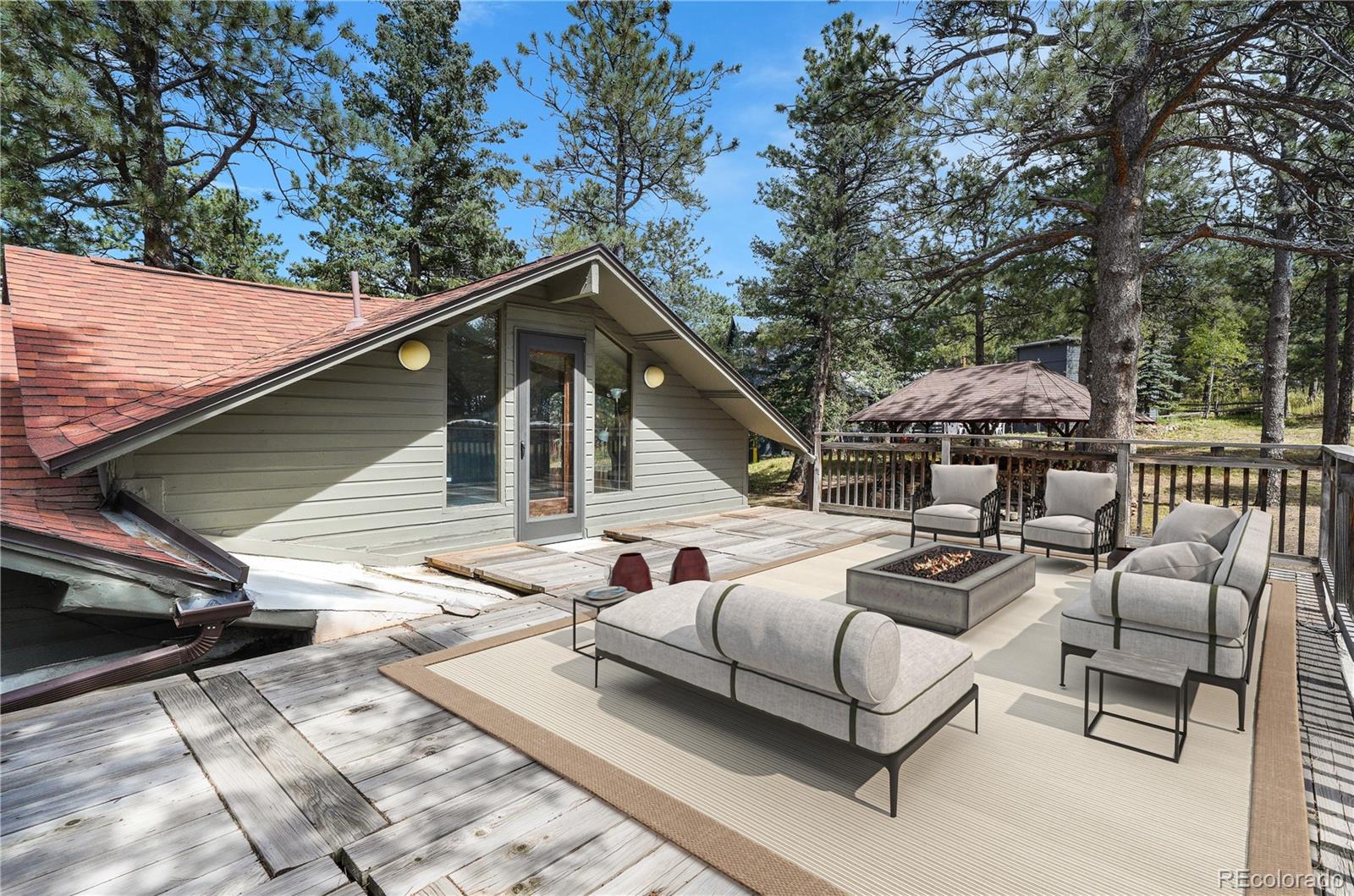 25997 Mountain View Road Golden, CO 80401 - Photo 7 of 23 a patio with couches and a fire pit