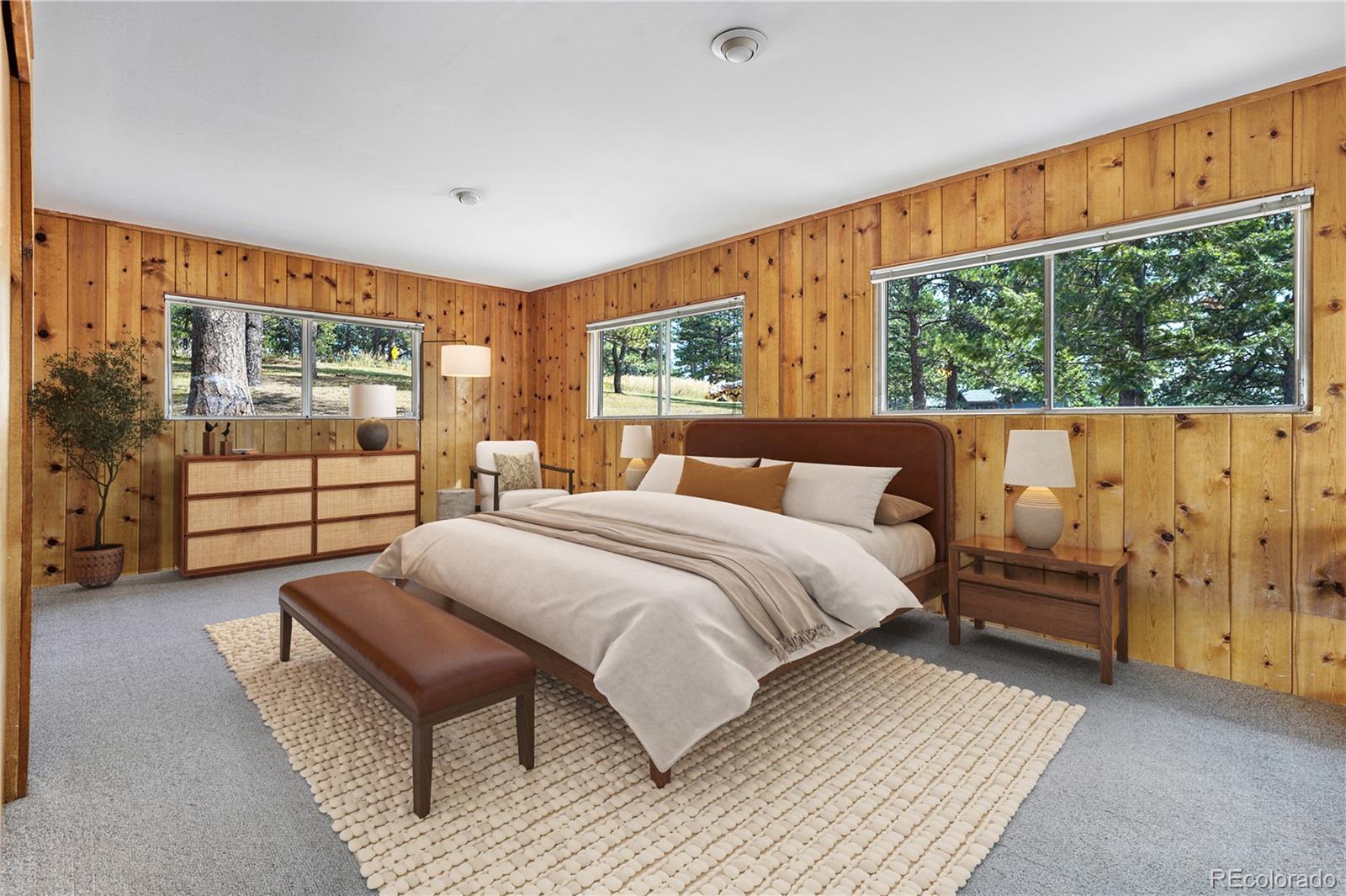 25997 Mountain View Road Golden, CO 80401 - Photo 9 of 23 a spacious bedroom with a bed and window