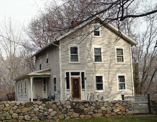 523 Nod Hill Road Wilton, CT 06897 - Photo 1 of 1 a front view of a house with a large tree