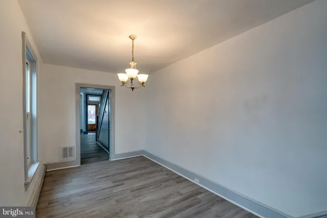 a view of livingroom with hardwood floor and hallway