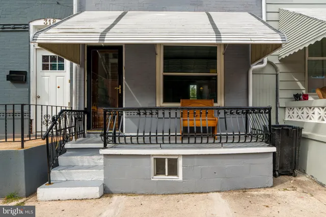 a front view of a house with glass windows