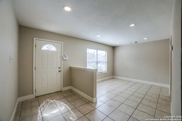 a view of an empty room and window