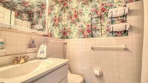 a bathroom with a sink toilet and vanity