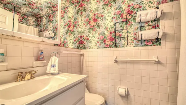 a bathroom with a sink toilet and vanity