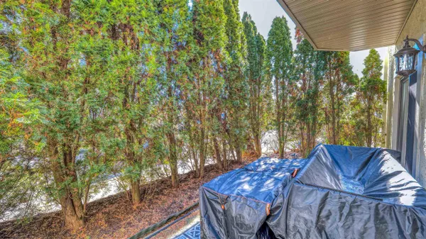 a view of backyard with outdoor seating and green space