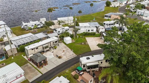 an aerial view of a house with a yard