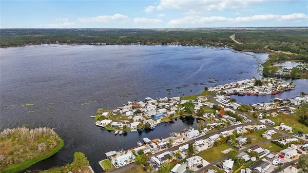 a view of a lake with a yard