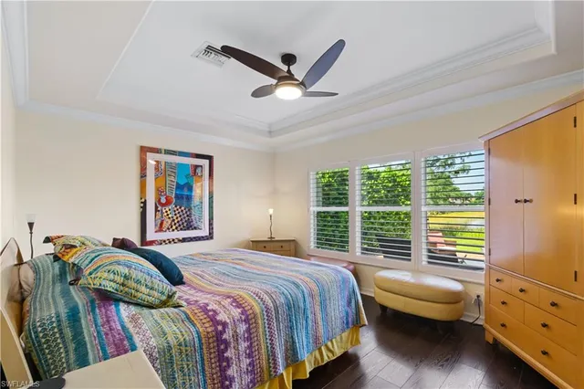 a bedroom with a bed dresser and a window